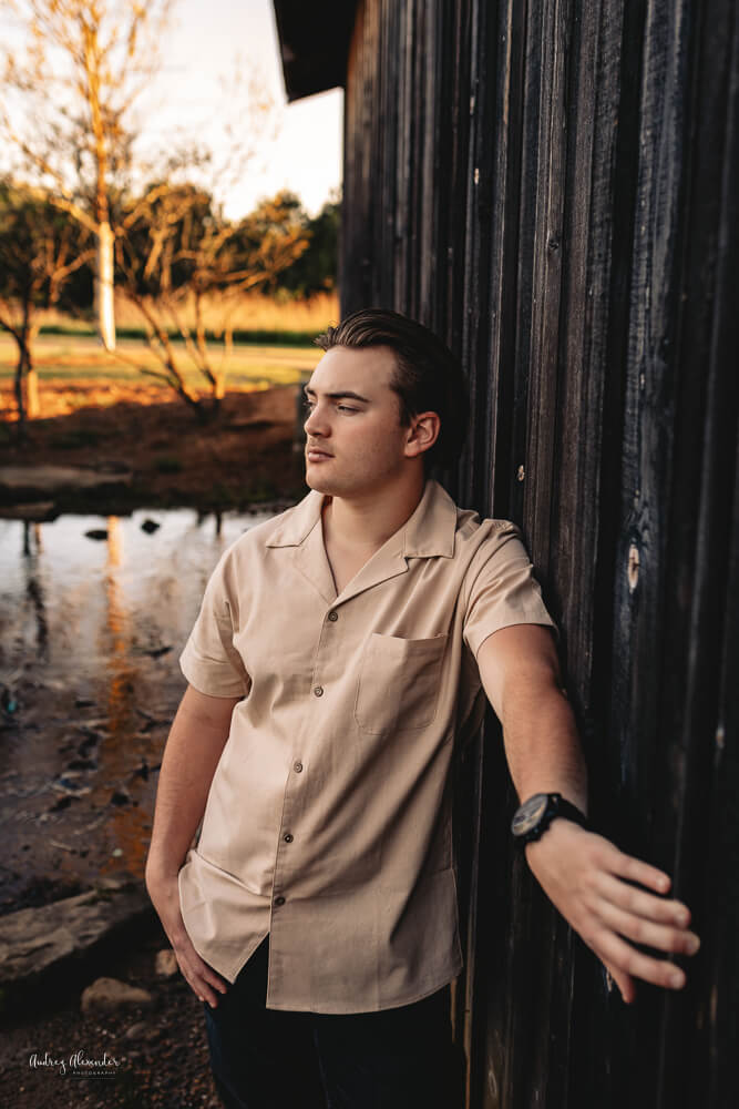 Senior Boy gazing out of view at sunset in Roswell