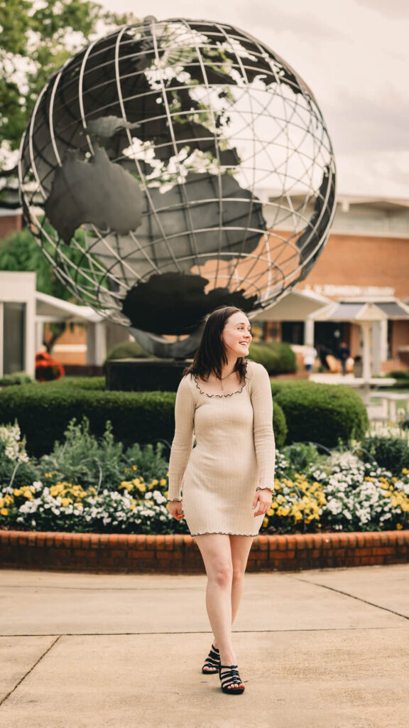 College senior on campus at Kennesaw State University celebrating