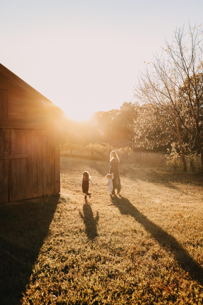 Candid portrait of mother with children at sunset in Marietta, GA
