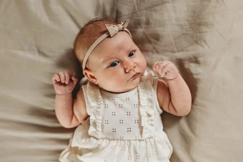 Newborn looking at camera at newborn photo shoot in Roswell, GA