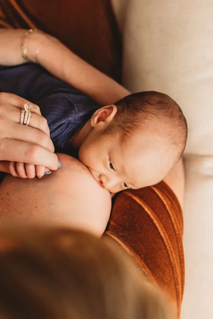 Breastfeeding portrait at newborn photography session in Roswell, GA