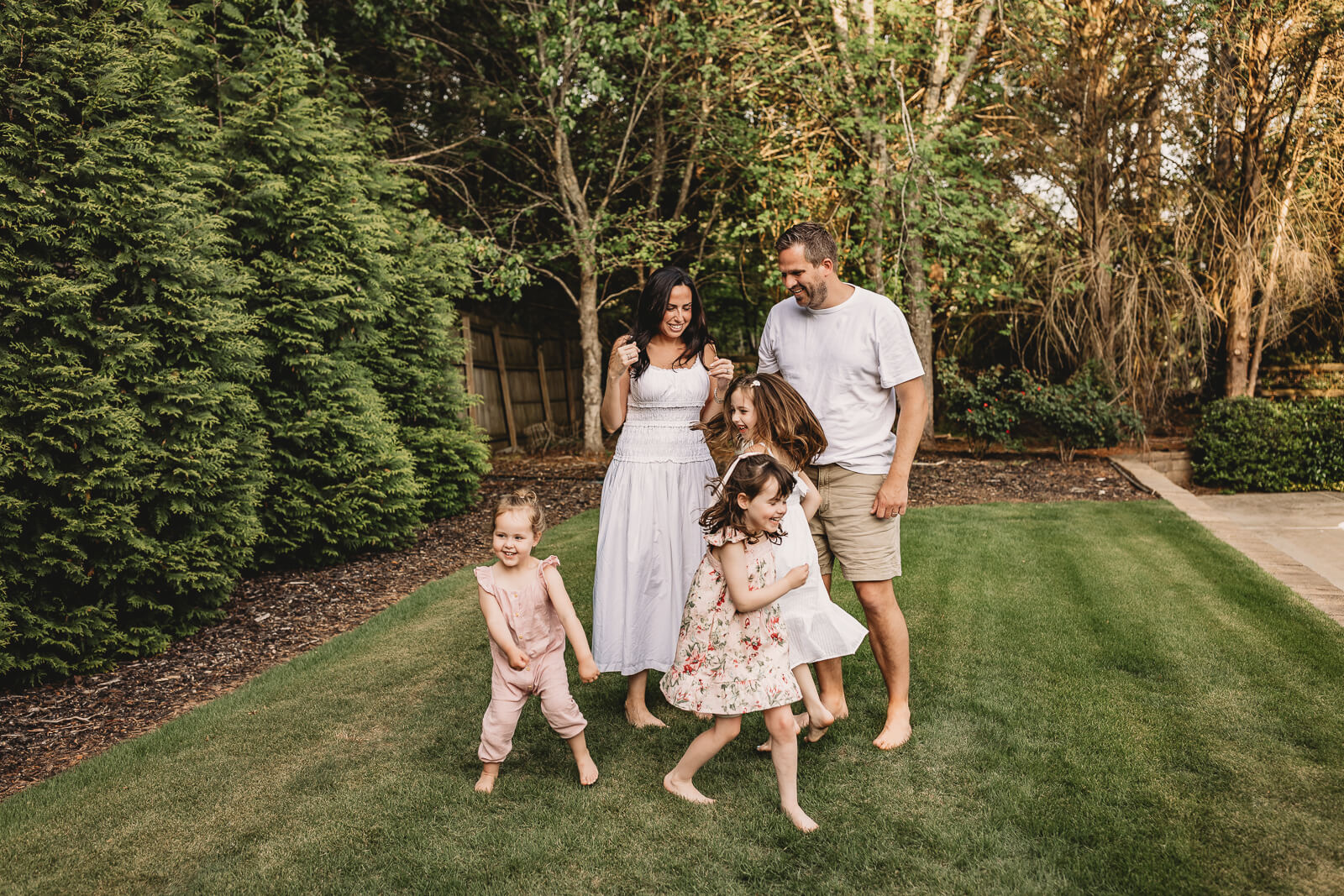 Family playing together at a home family session in Milton Ga