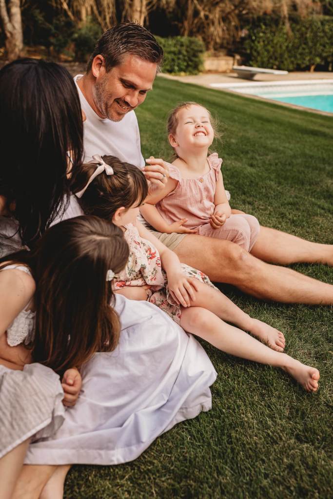 Toddler smiling in backyard photo session in Milton Ga