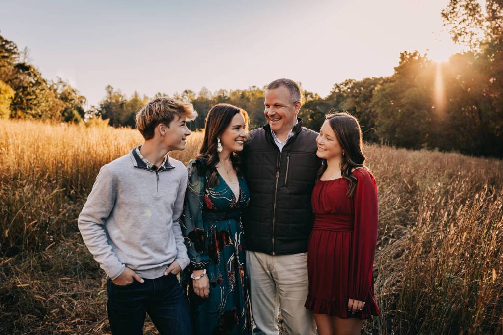 Milton family in a fall field portrait session with gorgeous lighting