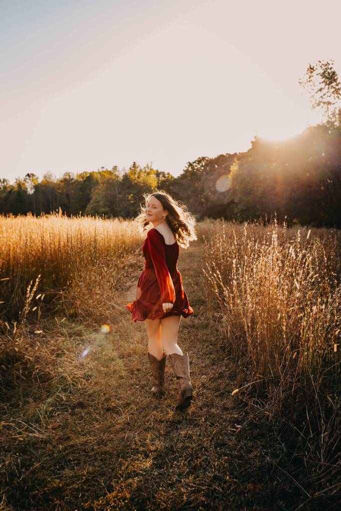 Teen smiling and having fun at a family photo session.