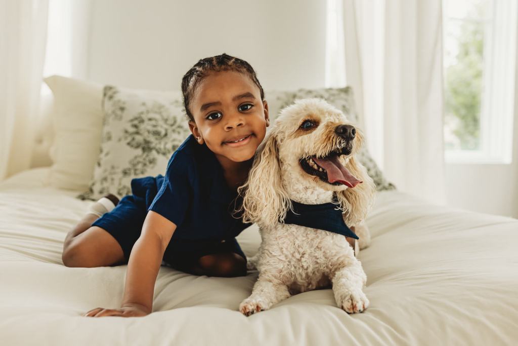 Toddler and dog portrait at studio