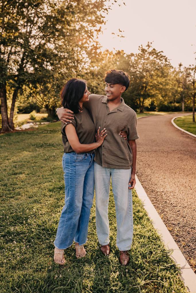 Mom and teen hugging during a family photo session
