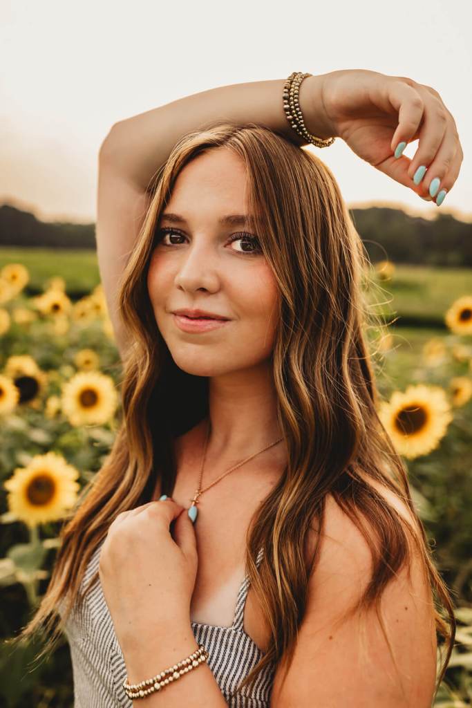 Marietta High school senior portrait with sunflowers